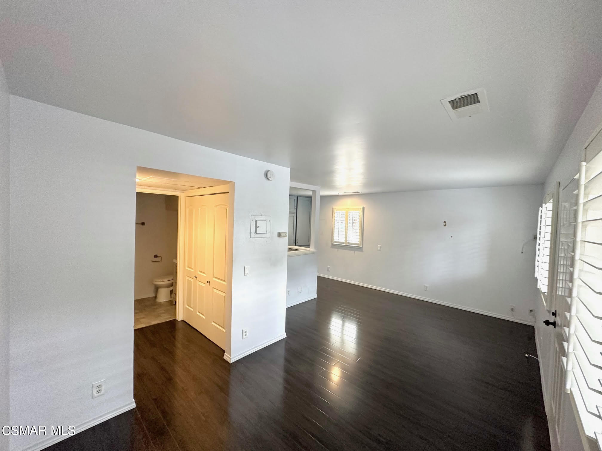 4541 Alamo Street, Unit A Simi Valley, CA 93063 - Photo 20 of 20 an empty room with wooden floor and windows