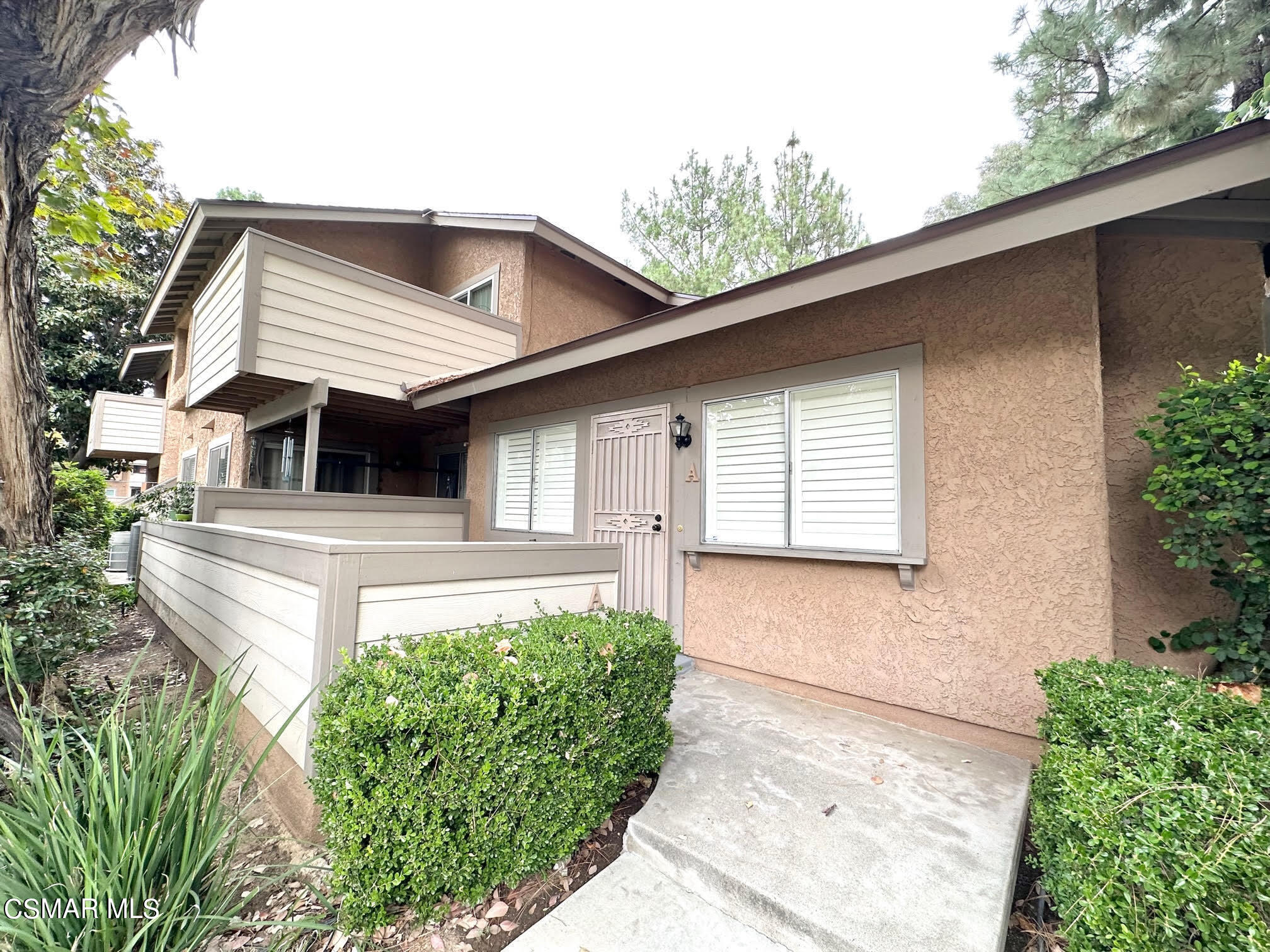 4541 Alamo Street, Unit A Simi Valley, CA 93063 - Photo 4 of 20 a front view of a house with garage