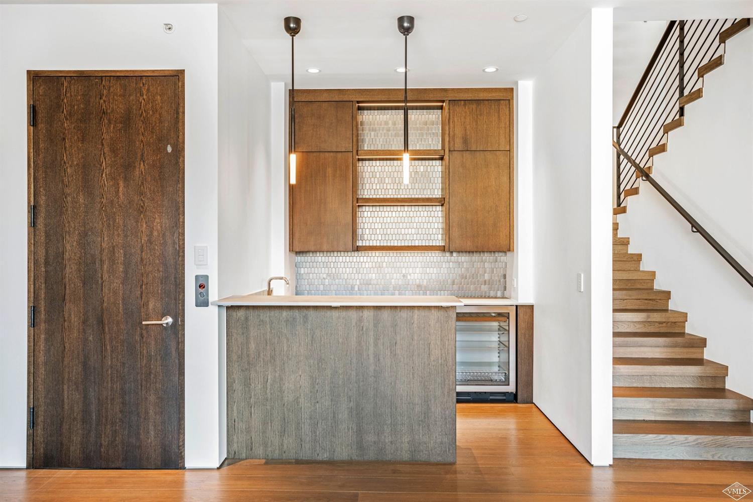 1450 Buffehr Creek Road Vail, CO 81657 - Photo 13 of 16 a view of an entryway with wooden floor and a window