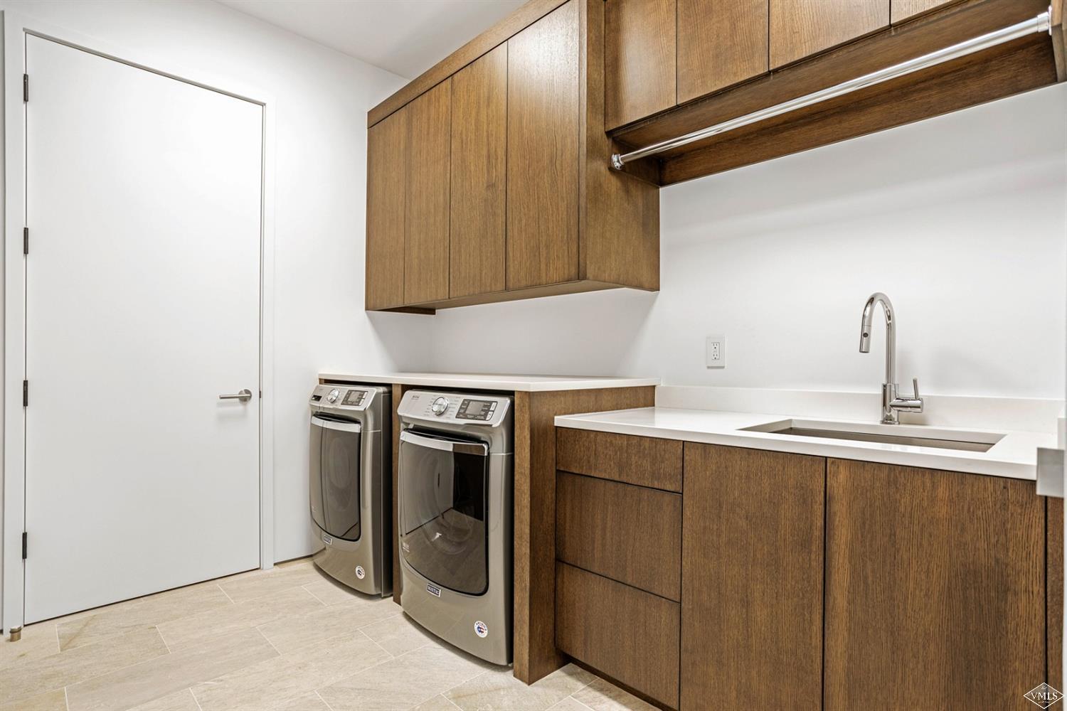 1450 Buffehr Creek Road Vail, CO 81657 - Photo 14 of 16 a kitchen with a sink and a refrigerator