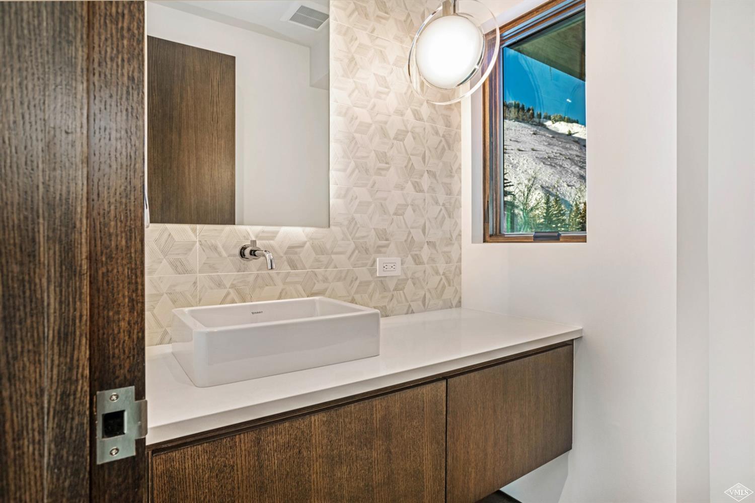 1450 Buffehr Creek Road Vail, CO 81657 - Photo 7 of 16 a bathroom with a sink and a bathtub