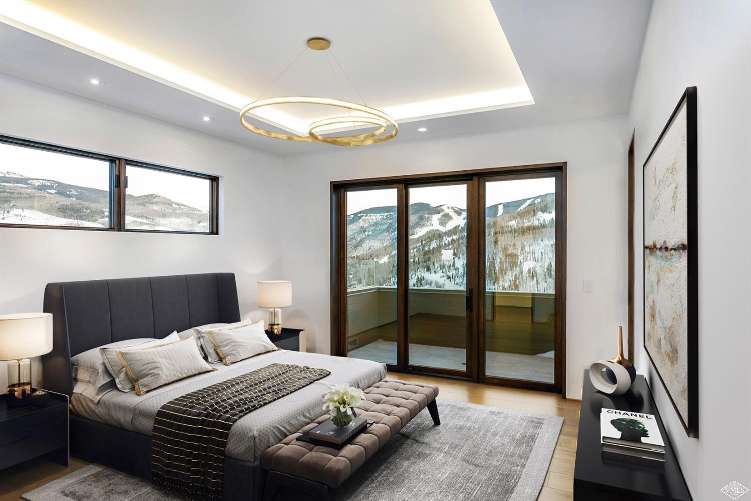 1450 Buffehr Creek Road Vail, CO 81657 - Photo 8 of 16 a bedroom with a bed and a large window