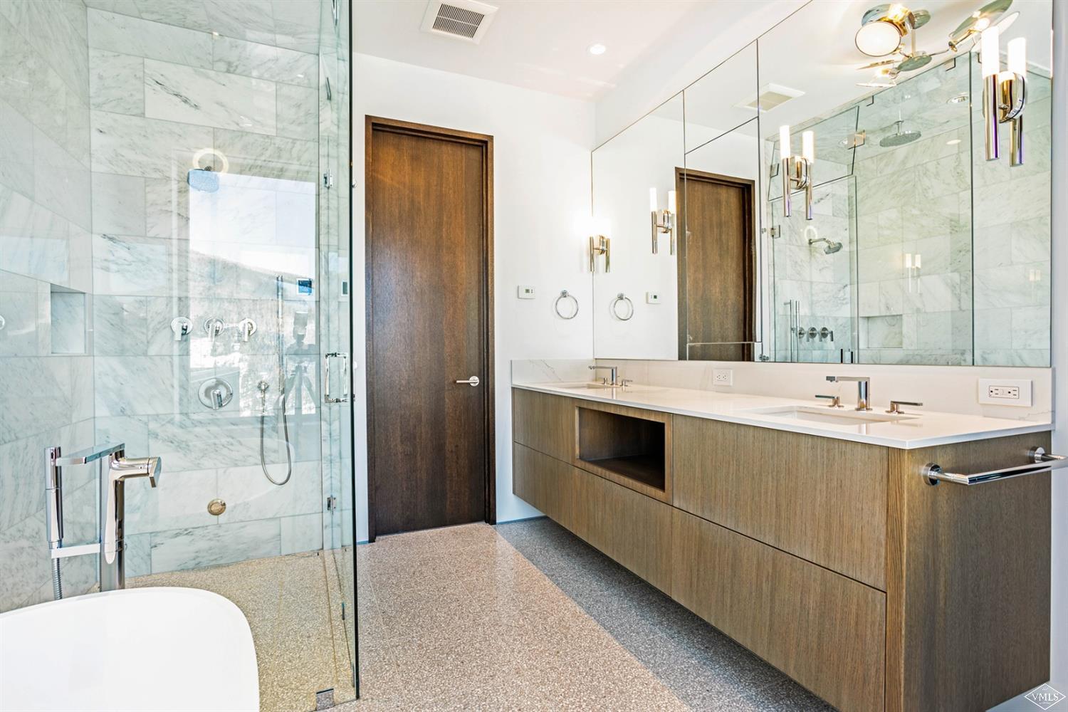 1450 Buffehr Creek Road Vail, CO 81657 - Photo 9 of 16 a bathroom with a double vanity sink toilet and shower
