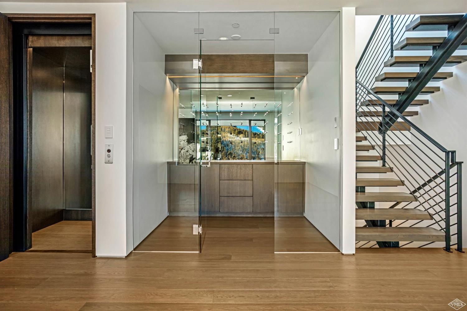 1450 Buffehr Creek Road Vail, CO 81657 - Photo 10 of 16 a view of entryway and hall with wooden floor