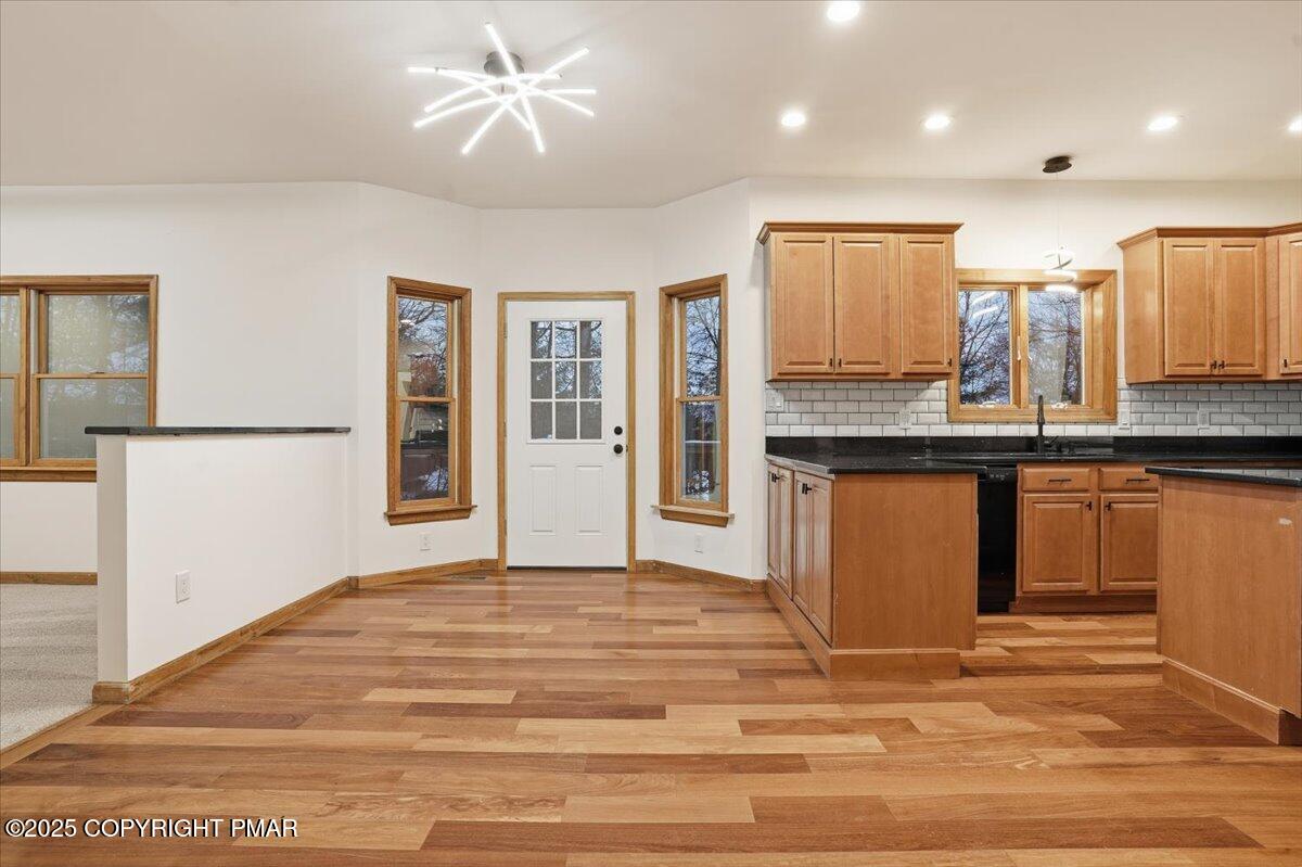 1395 Kelly Road Stroudsburg, PA 18360 - Photo 22 of 48 a large white kitchen with granite countertop a stove and a sink