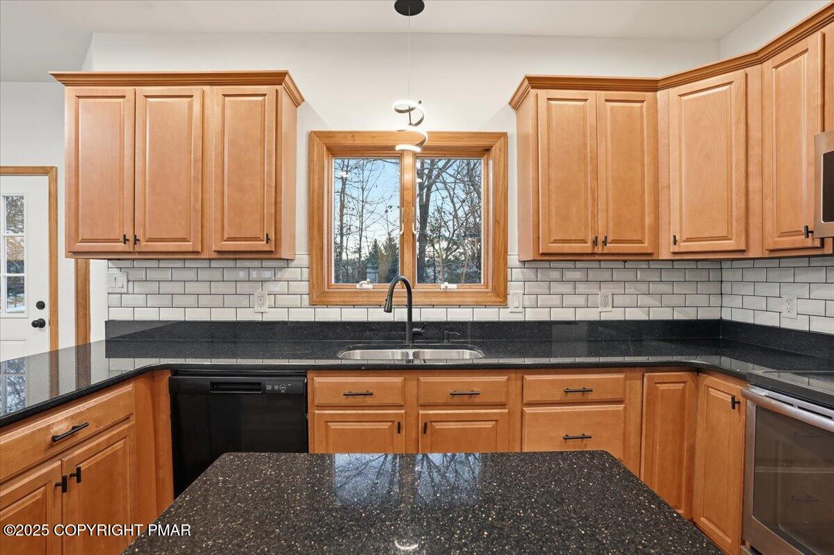 1395 Kelly Road Stroudsburg, PA 18360 - Photo 24 of 48 a kitchen with granite countertop a sink a stove and cabinets