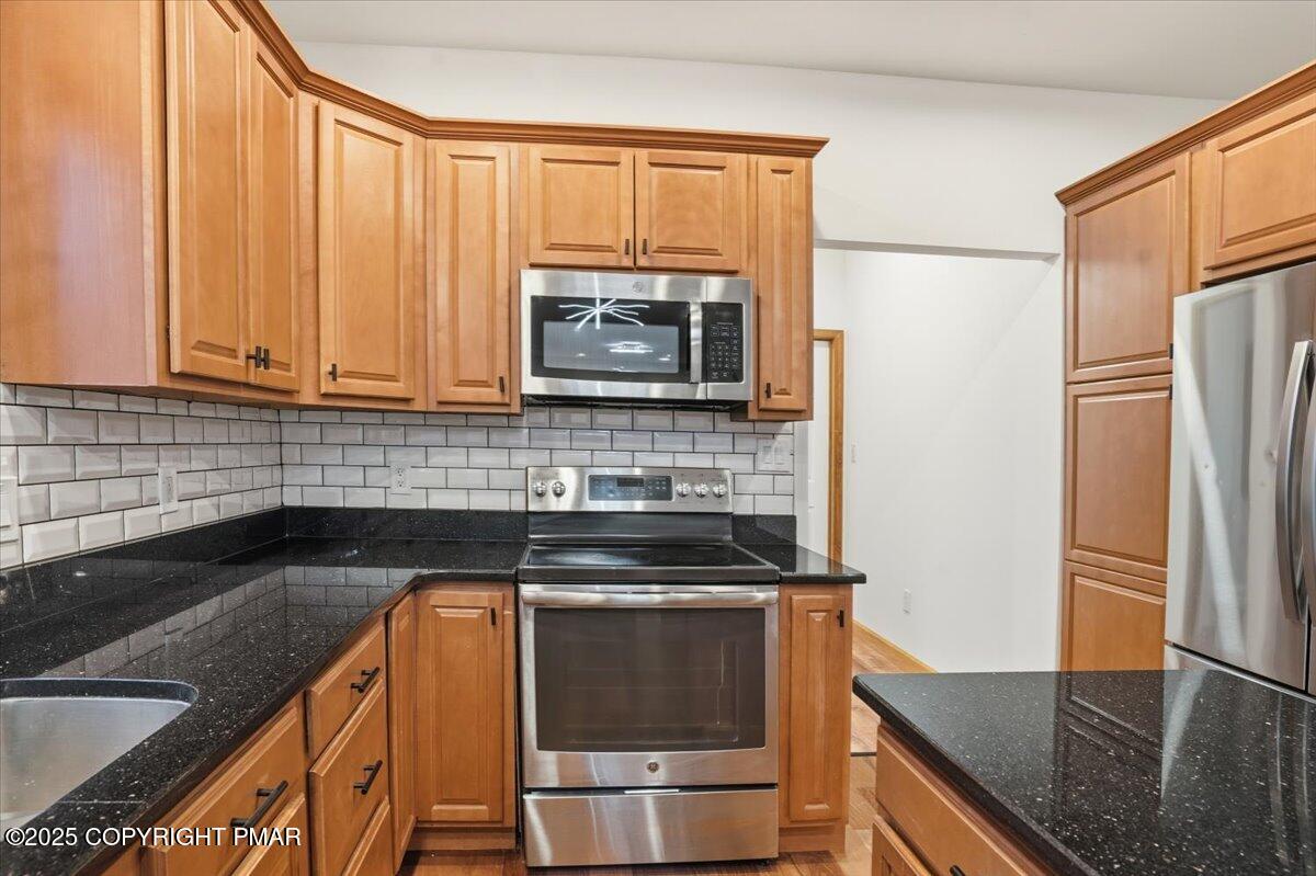 1395 Kelly Road Stroudsburg, PA 18360 - Photo 25 of 48 a kitchen with a refrigerator and a sink