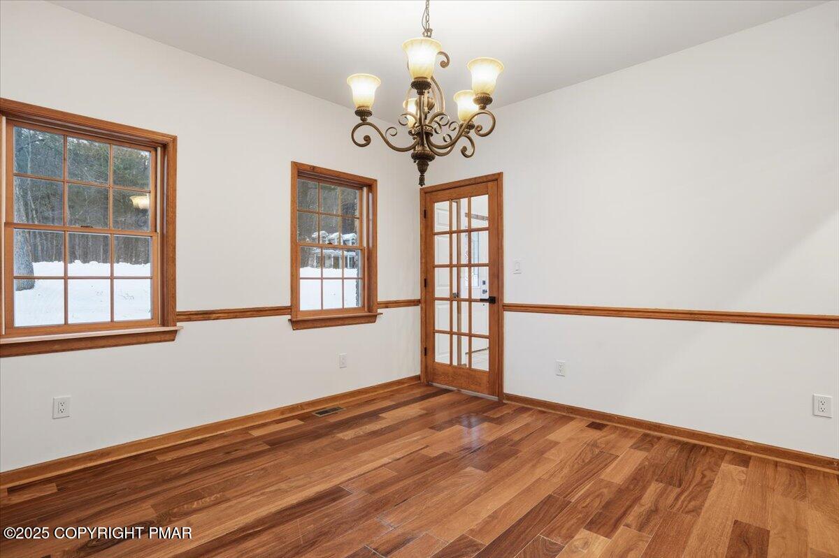 1395 Kelly Road Stroudsburg, PA 18360 - Photo 26 of 48 a view of an empty room with wooden floor and a window