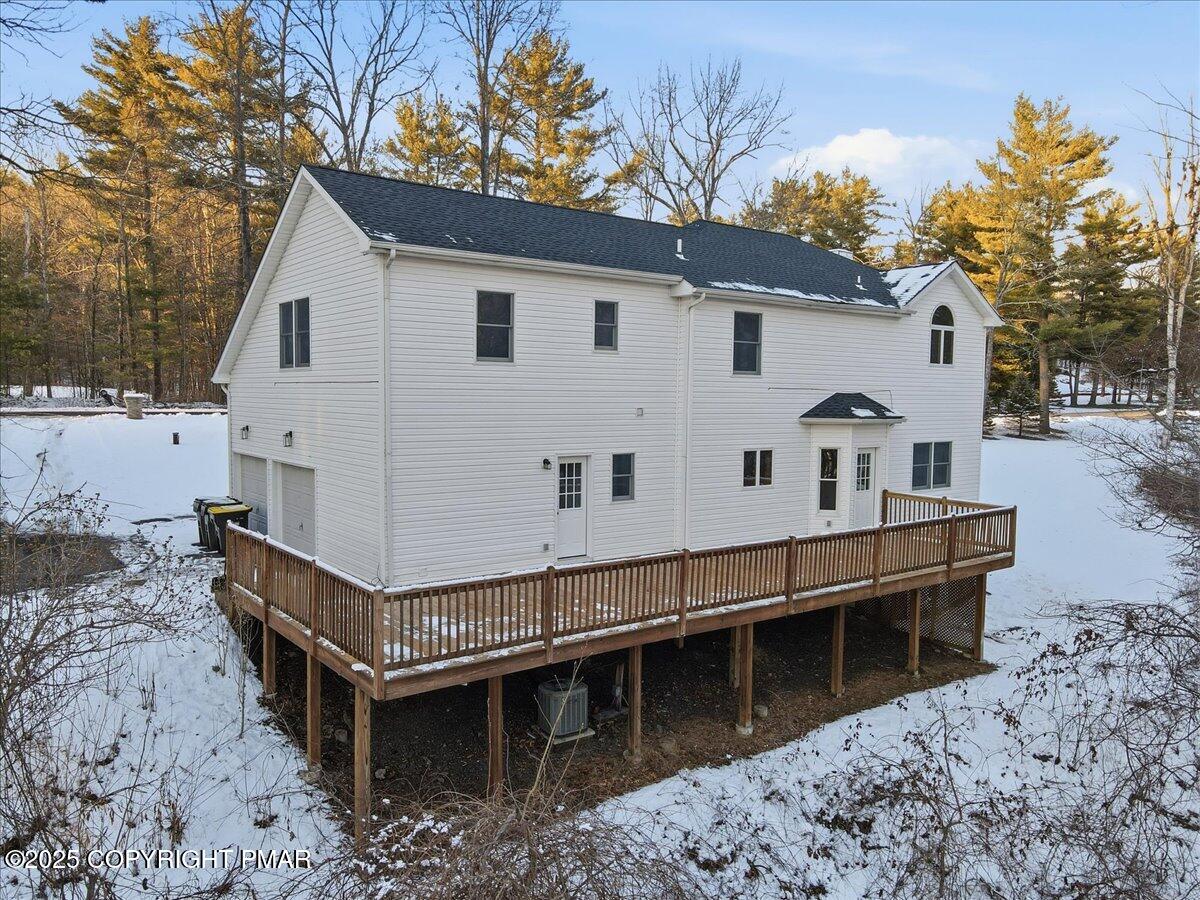 1395 Kelly Road Stroudsburg, PA 18360 - Photo 4 of 48 a view of a house with a wooden deck