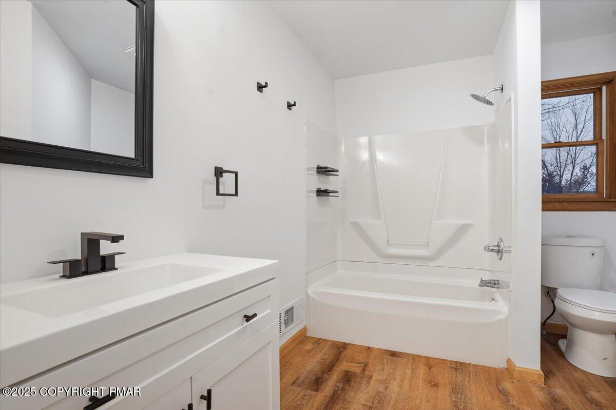 1395 Kelly Road Stroudsburg, PA 18360 - Photo 41 of 48 a bathroom with a sink a toilet and a bathtub