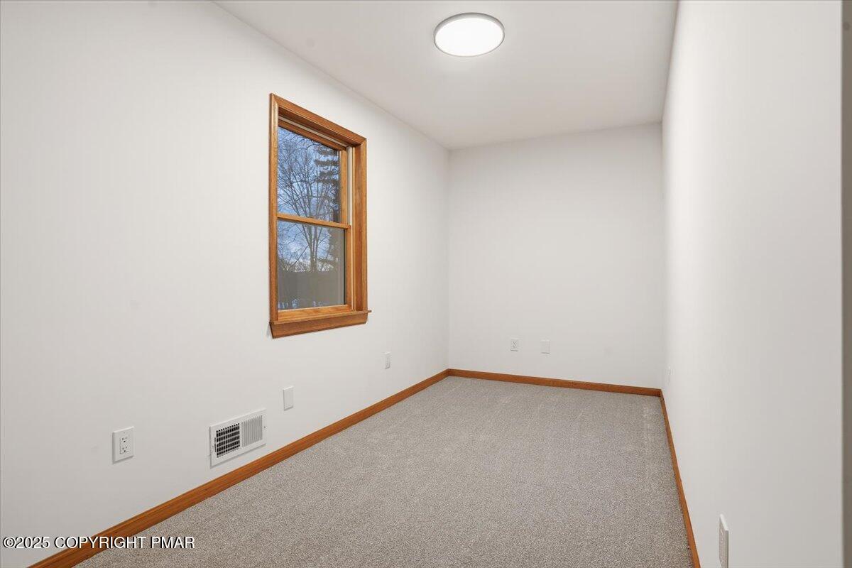 1395 Kelly Road Stroudsburg, PA 18360 - Photo 42 of 48 an empty room with windows