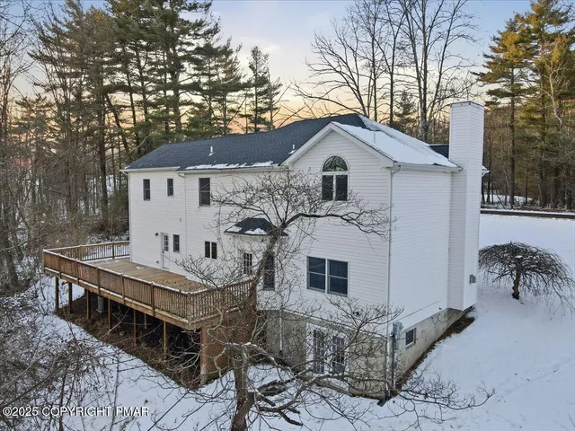 a view of a house with a snow