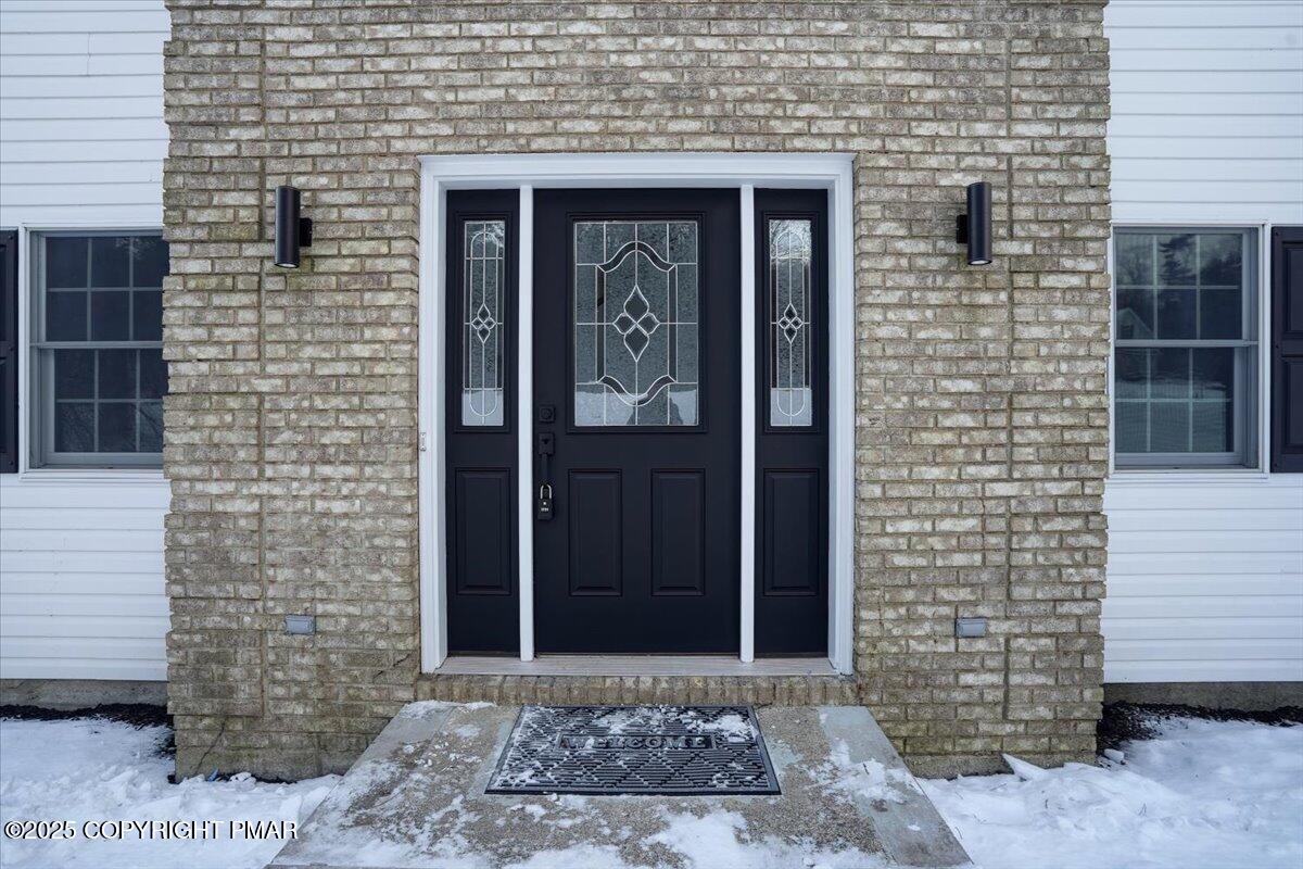 1395 Kelly Road Stroudsburg, PA 18360 - Photo 7 of 48 a front view of a brick house