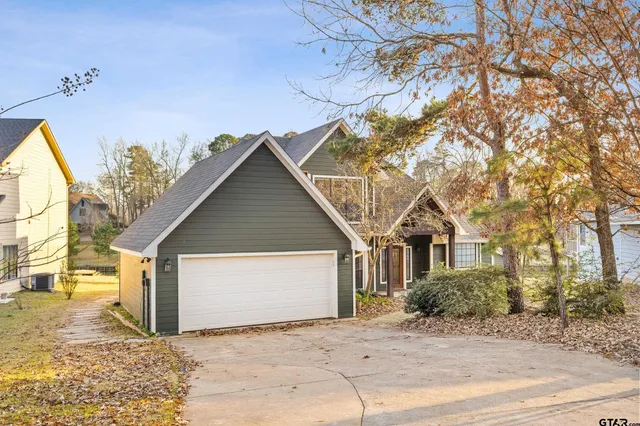 a view of a house with a snow in the yard