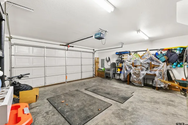 a view of a garage with a table and chairs