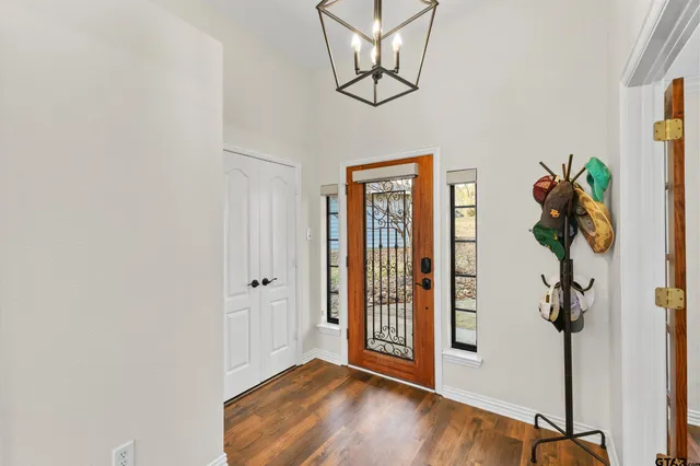 a view of an entryway with wooden floor
