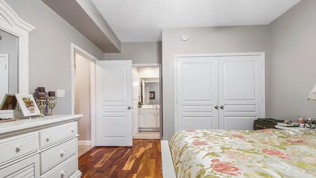 a bedroom with a bed and closet