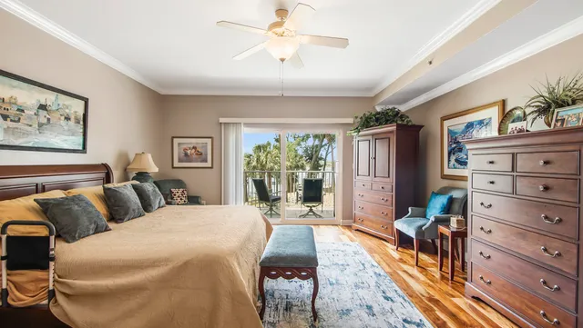 a spacious bedroom with a bed and a dresser