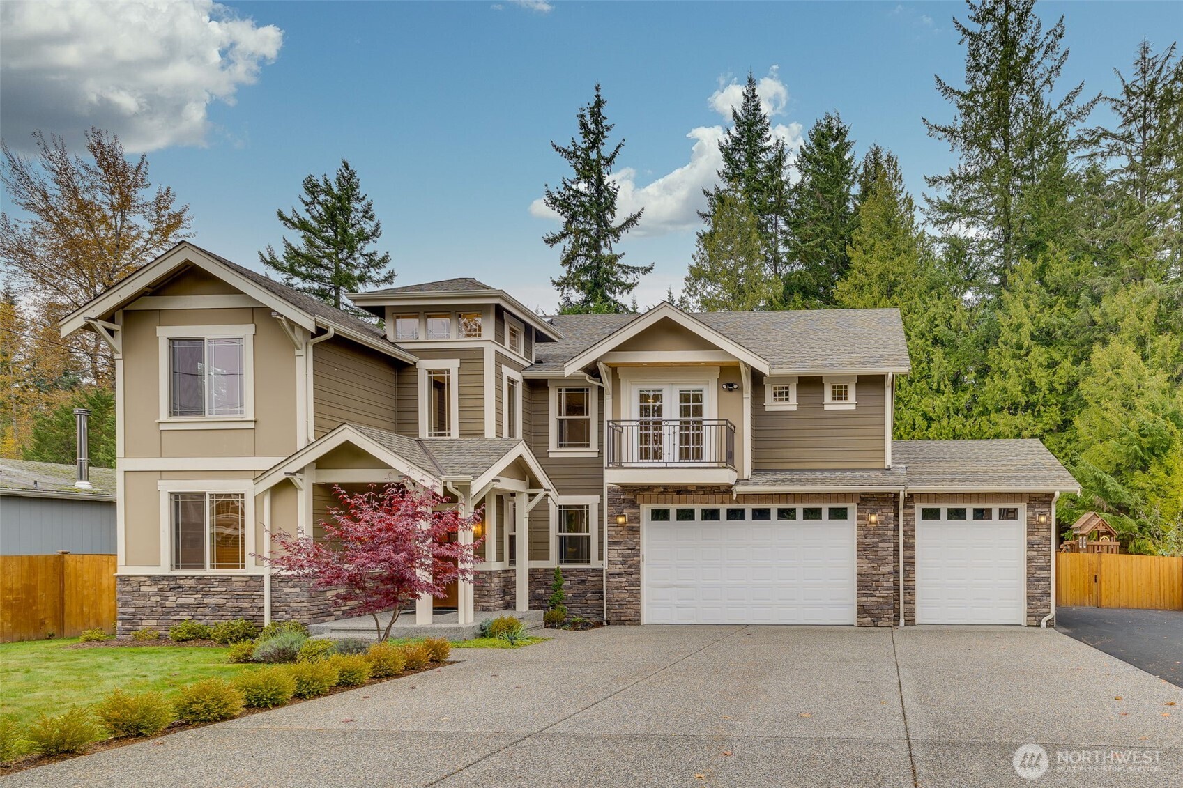 12801 218th Place Southeast Snohomish, WA 98296 - Photo 1 of 38 a front view of a house with a yard and trees
