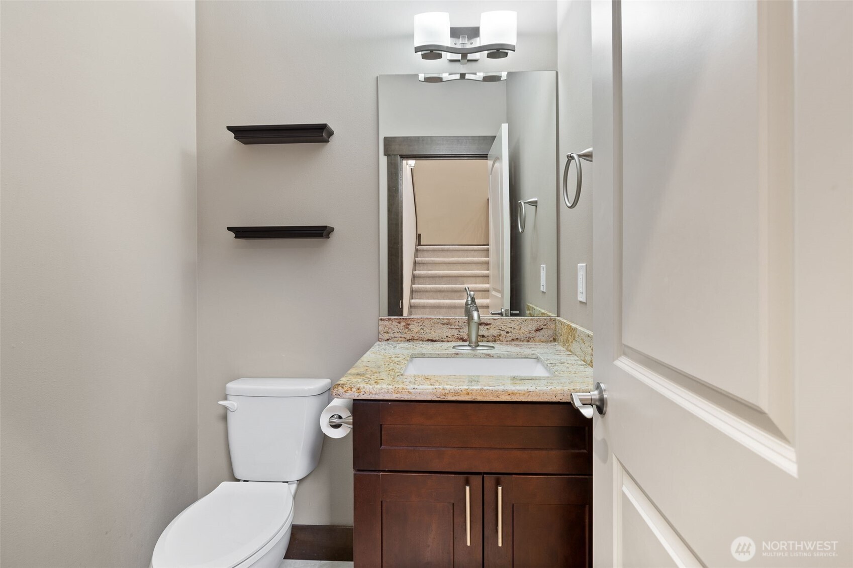12801 218th Place Southeast Snohomish, WA 98296 - Photo 12 of 38 a bathroom with a sink vanity mirror and toilet