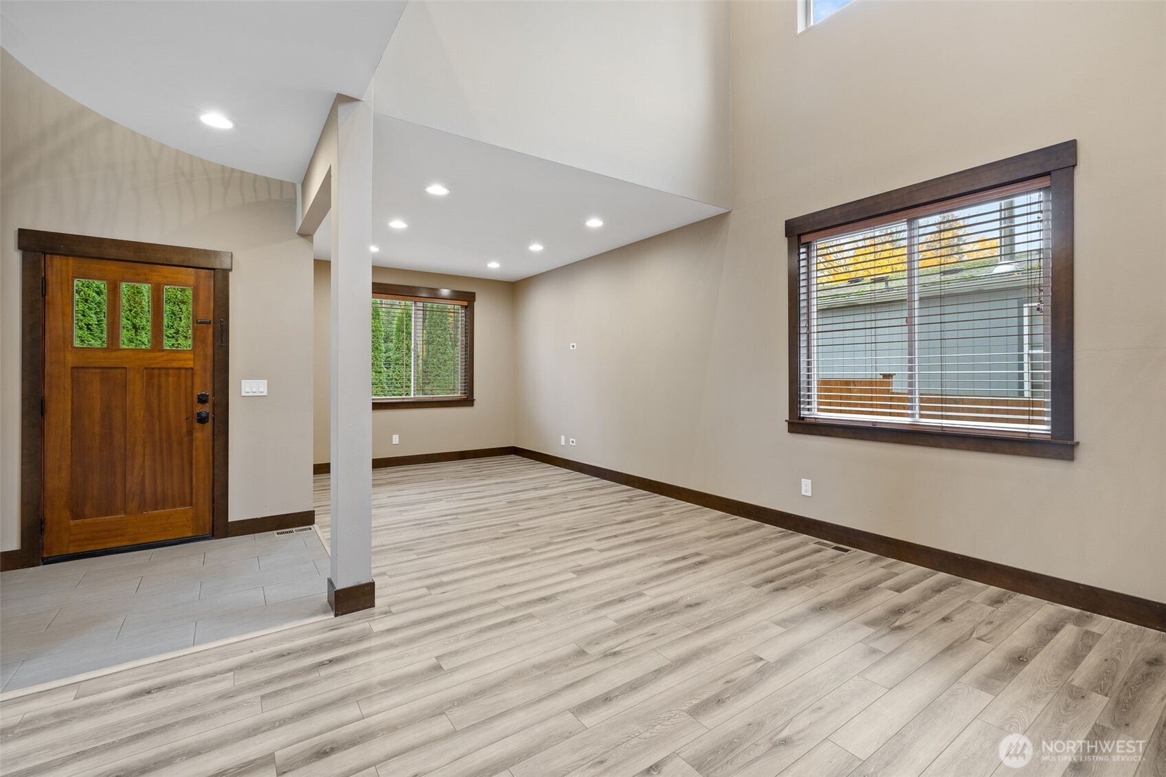 12801 218th Place Southeast Snohomish, WA 98296 - Photo 3 of 38 a view of an empty room with wooden floor and a window