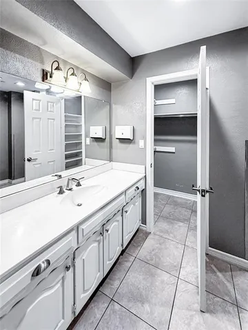 a bathroom with a sink and a shower