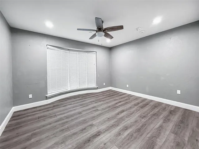 a living room with furniture and flowers