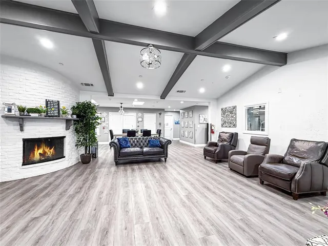 a view of a dining area with furniture and wooden floor