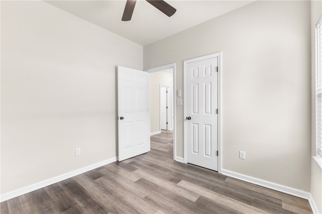 1601 West 17th Street Bryan, TX 77803 - Photo 13 of 16 an empty room with windows and closet