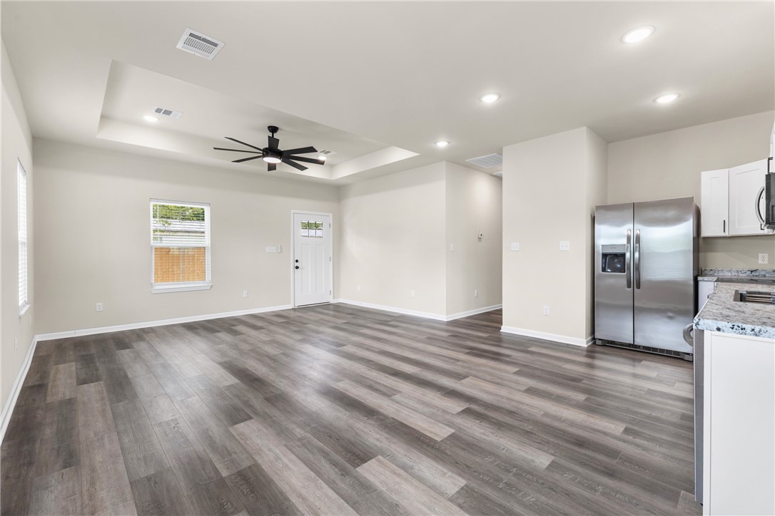1601 West 17th Street Bryan, TX 77803 - Photo 5 of 16 a view of a kitchen with a sink and a refrigerator