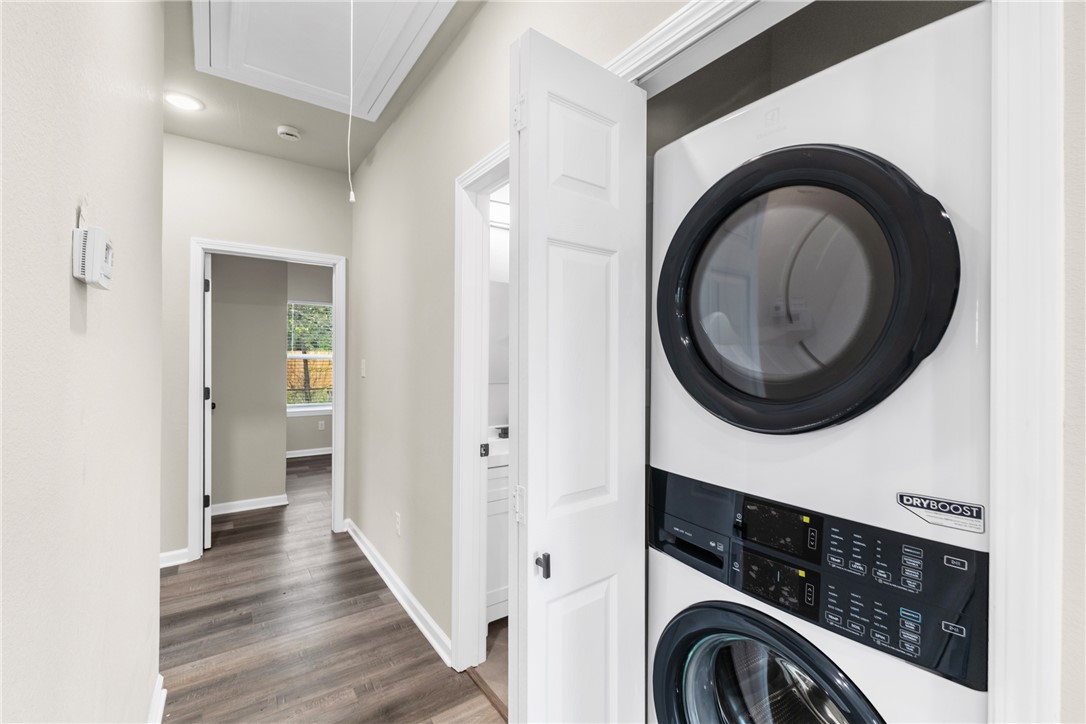 1601 West 17th Street Bryan, TX 77803 - Photo 7 of 16 a view of a hallway with washer and dryer