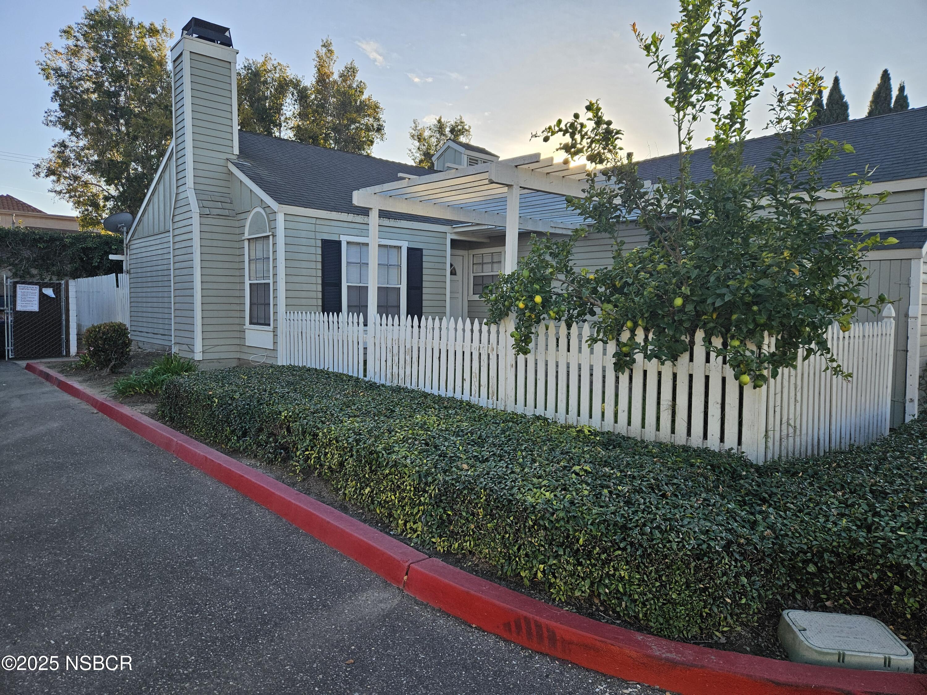 812 Del Rey Lane Santa Maria, CA 93454 - Photo 2 of 12 a front view of a house with a garden
