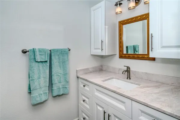 a bathroom with a sink and a mirror