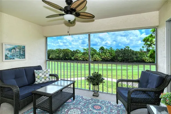 a balcony with furniture and a garden