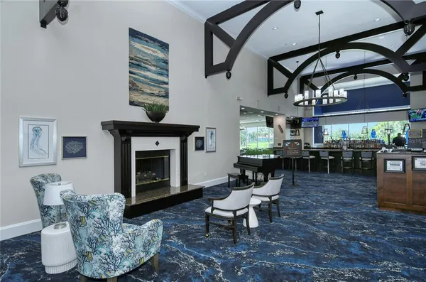 a living room filled with furniture and a flat screen tv