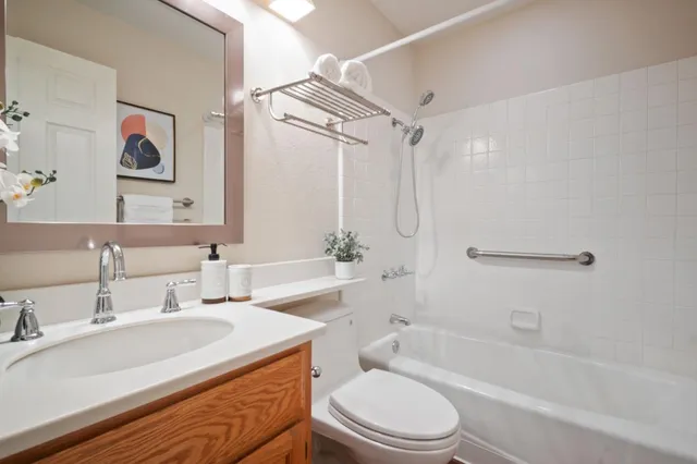 a bathroom with a sink a toilet and a bathtub