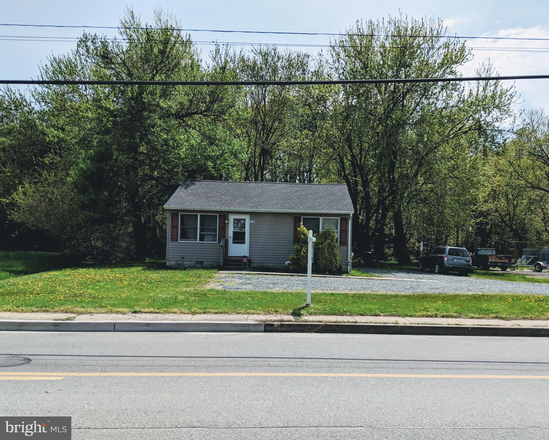 a view of a house and a yard