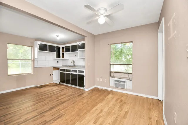 a kitchen with stainless steel appliances a white stove top oven and sink