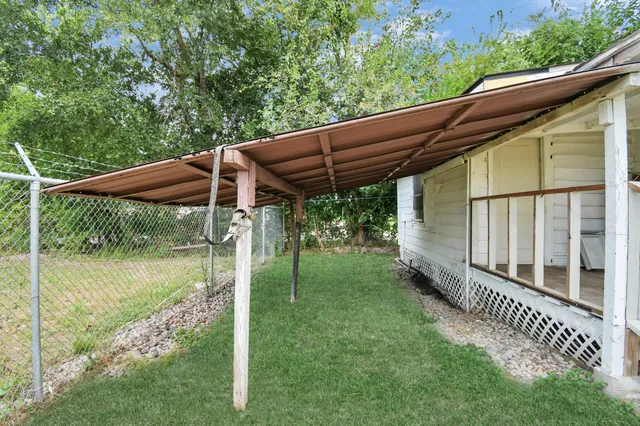 a view of backyard with green space