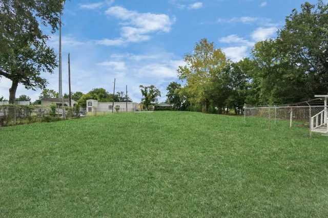 a view of a garden with a building in the background