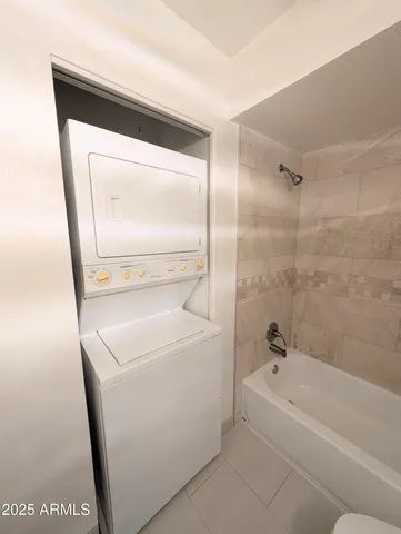 a bathroom with a sink a mirror and a bathtub