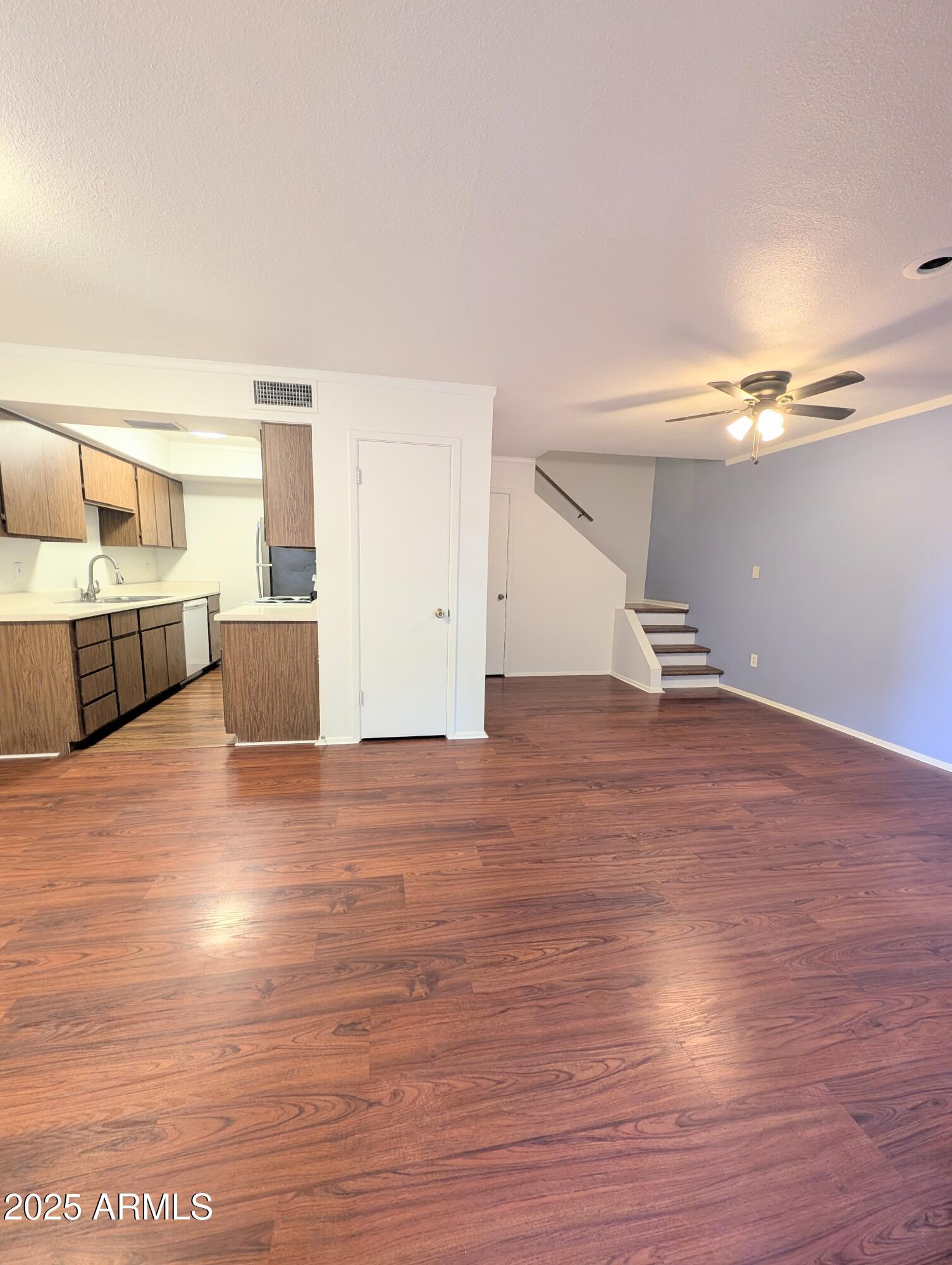 Undisclosed Address Chandler, AZ 85225 - Photo 2 of 21 a view of a room with wooden floor and cabinet