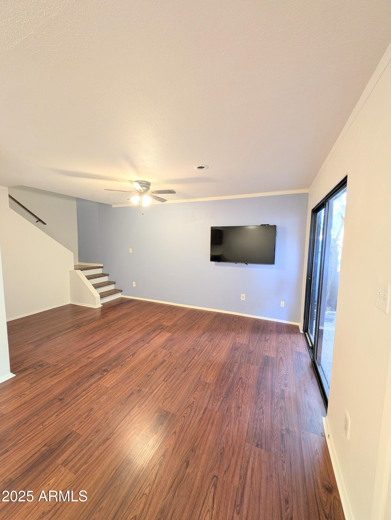 Undisclosed Address Chandler, AZ 85225 - Photo 3 of 21 a view of empty room with wooden floor