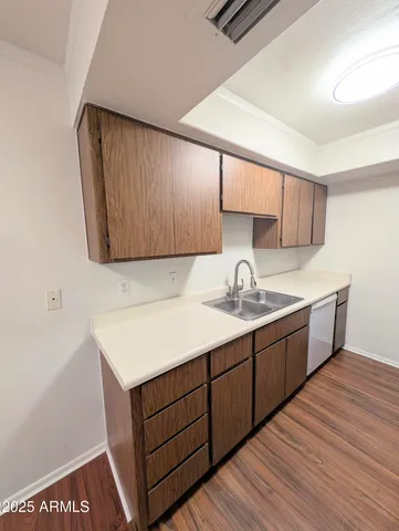 a kitchen with a sink and cabinets