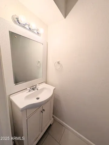 a bathroom with a sink and mirror