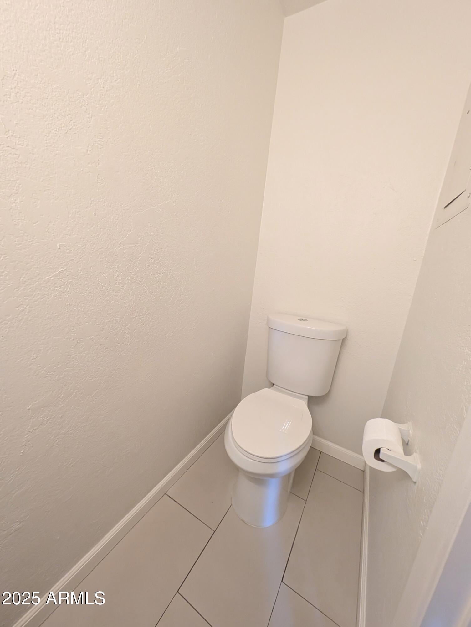 Undisclosed Address Chandler, AZ 85225 - Photo 10 of 21 a white toilet sitting next to a white wall