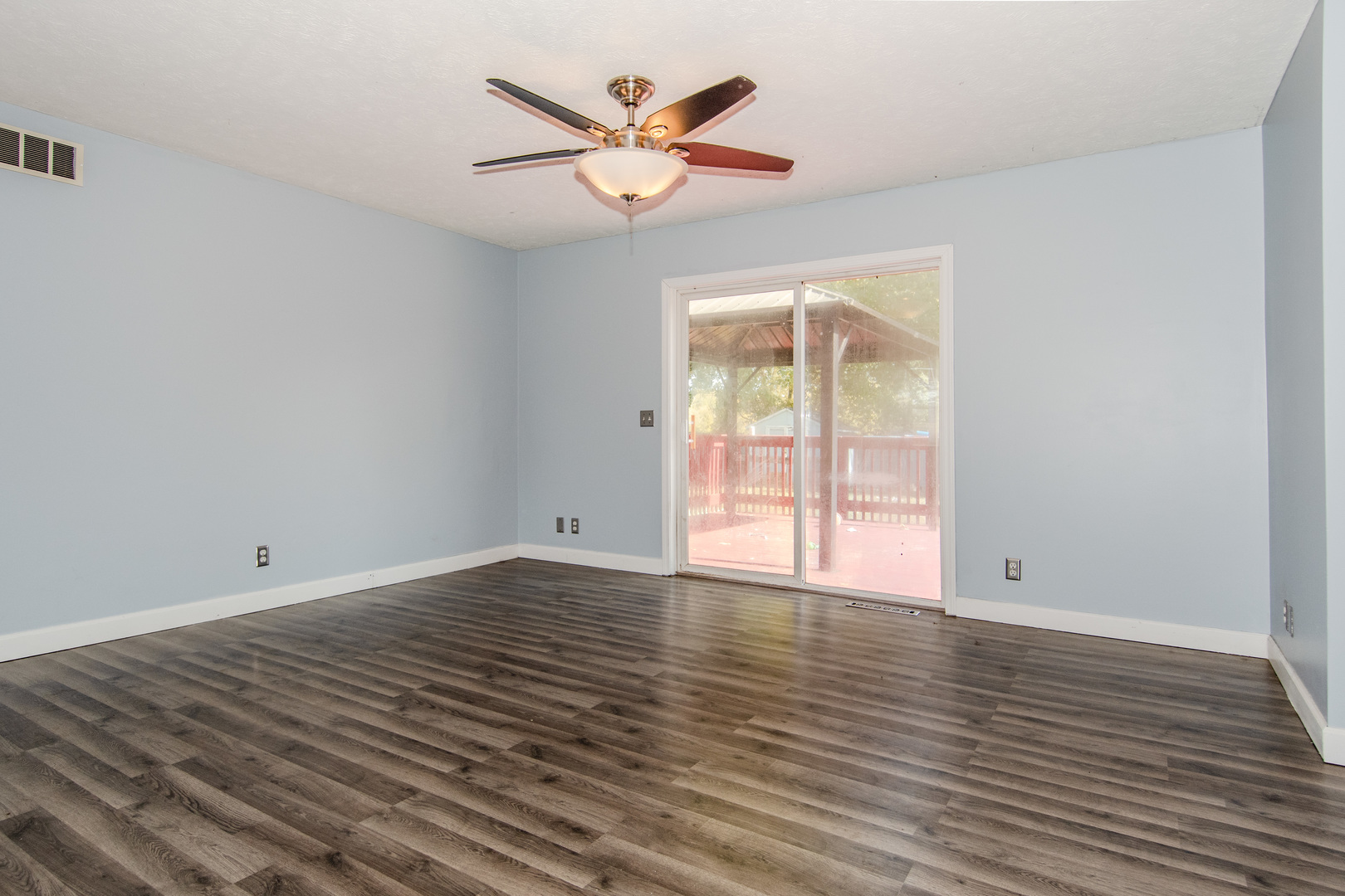2970 North Dwight Road Morris, IL 60450 - Photo 13 of 43 a view of an empty room with window and wooden floor