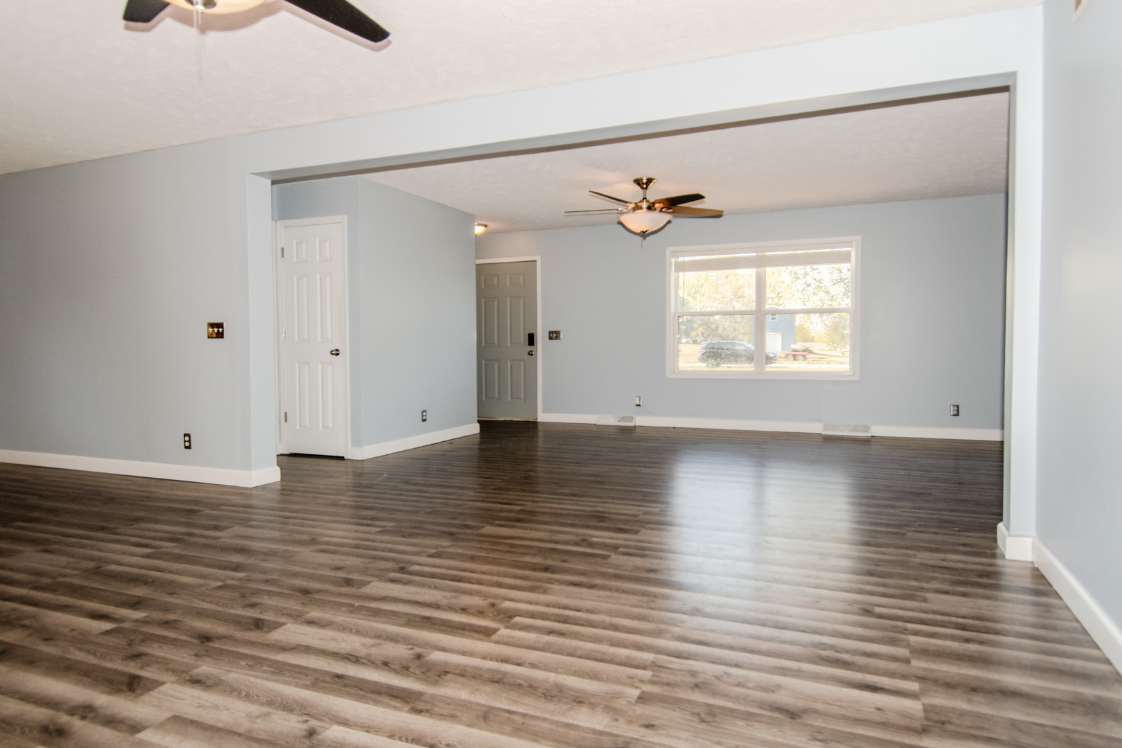 2970 North Dwight Road Morris, IL 60450 - Photo 16 of 43 an empty room with wooden floor and windows