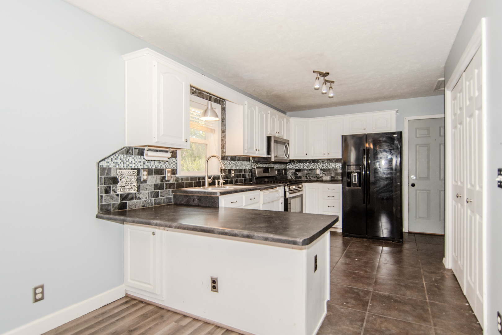 2970 North Dwight Road Morris, IL 60450 - Photo 23 of 43 a kitchen with stainless steel appliances granite countertop a sink stove and refrigerator