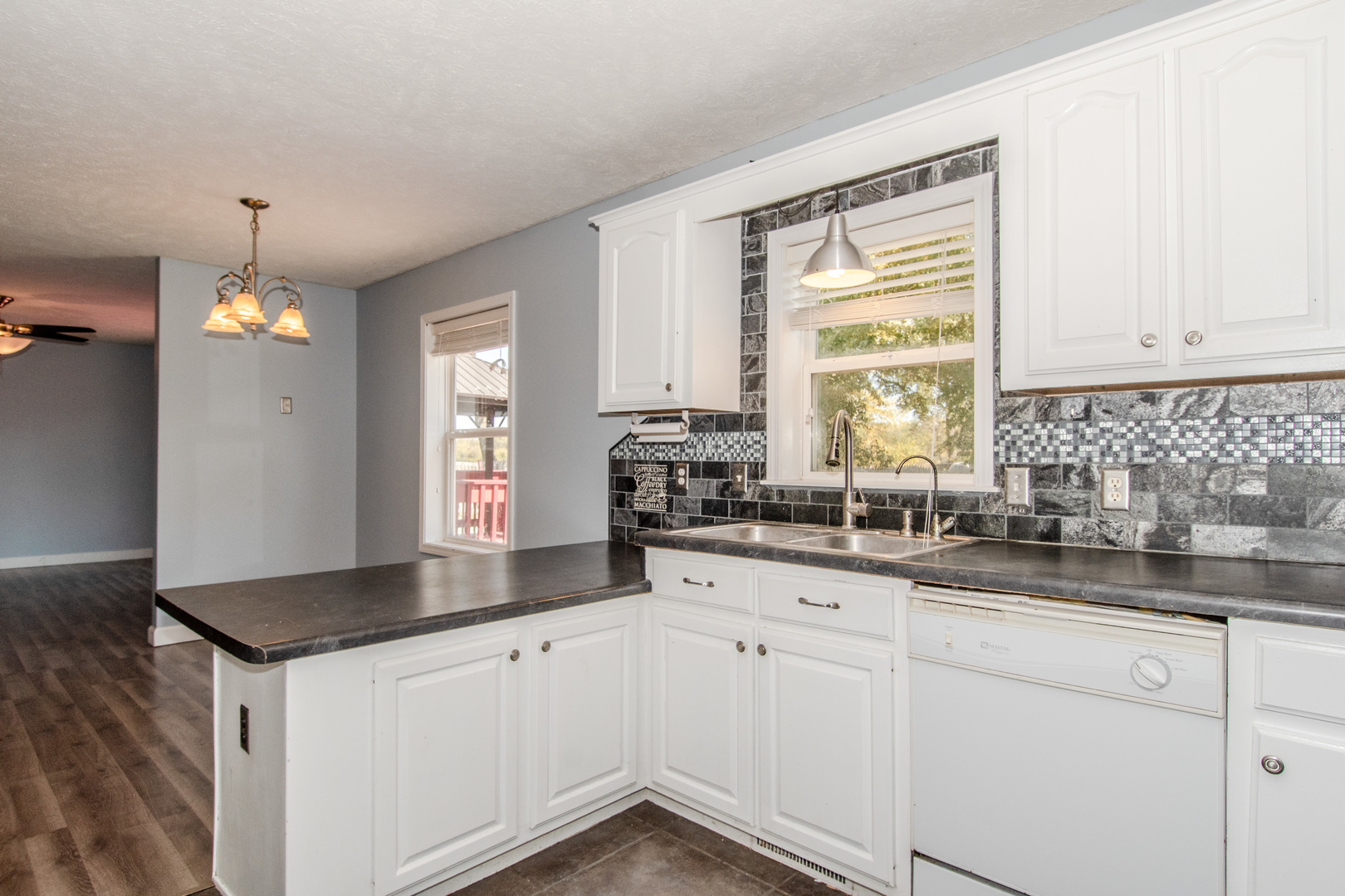 2970 North Dwight Road Morris, IL 60450 - Photo 30 of 43 a kitchen with granite countertop white cabinets and a sink